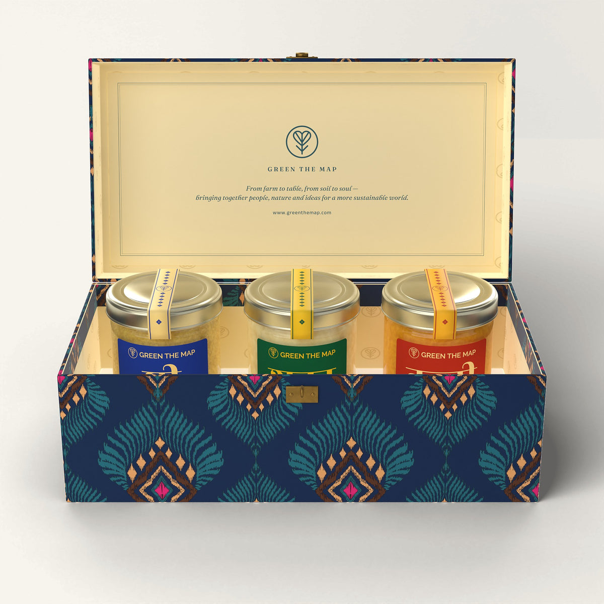 The open Mor-pankh 3-jar gift box with ghee, honey and turmeric jars, on off-white.