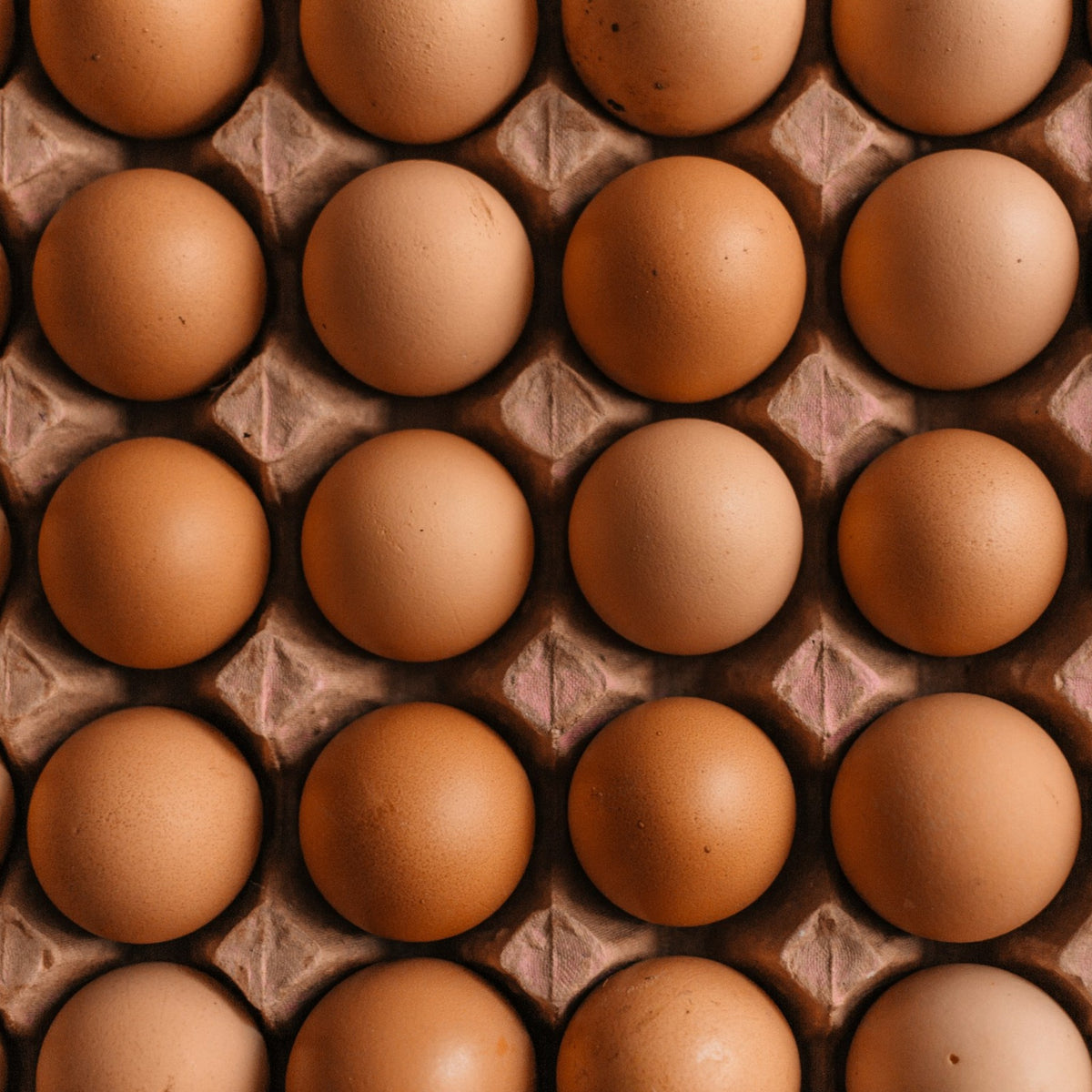A tray of brown eggs
