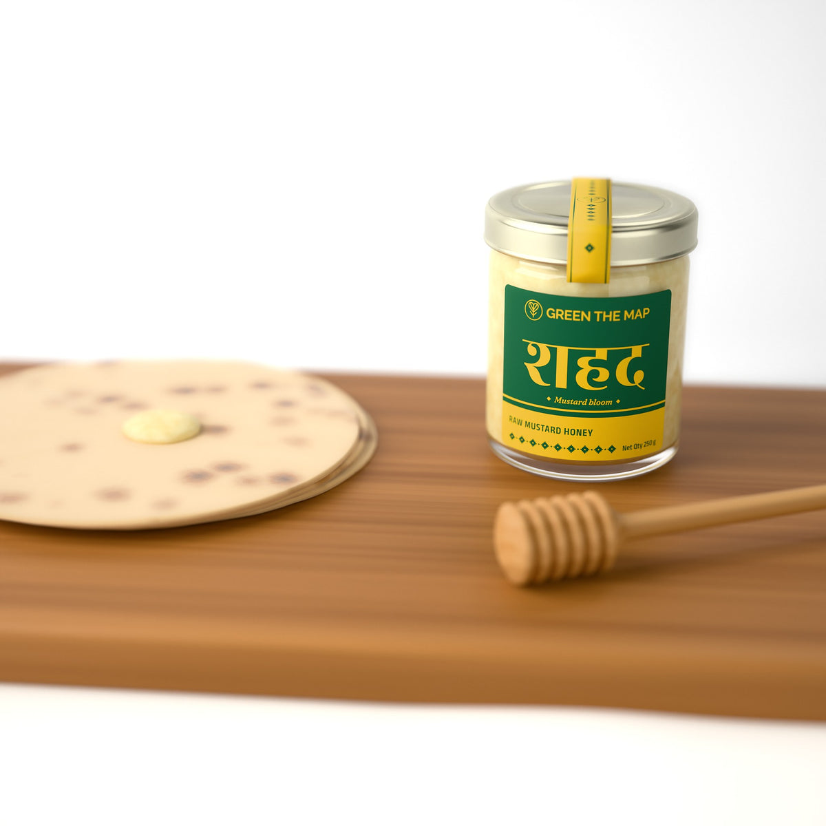 A honey jar on a wooden board with bread and a dipper.