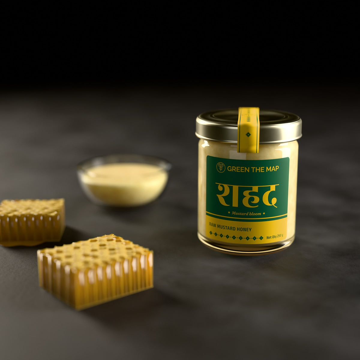 A jar of raw mustard honey on dark slate with pieces of honeycomb and a bowl of honey.